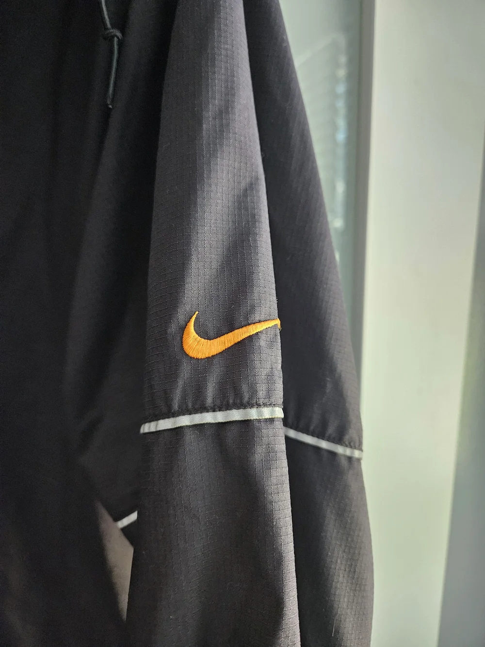 Nike Black Windbreaker Jacket with Orange Accents
